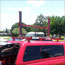 Wood and steel kayak rack build full assembly mounted on roof of camper.